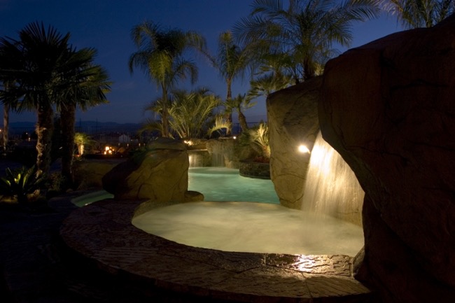 BSH Pools — geometric modern pool with LED lighting at night