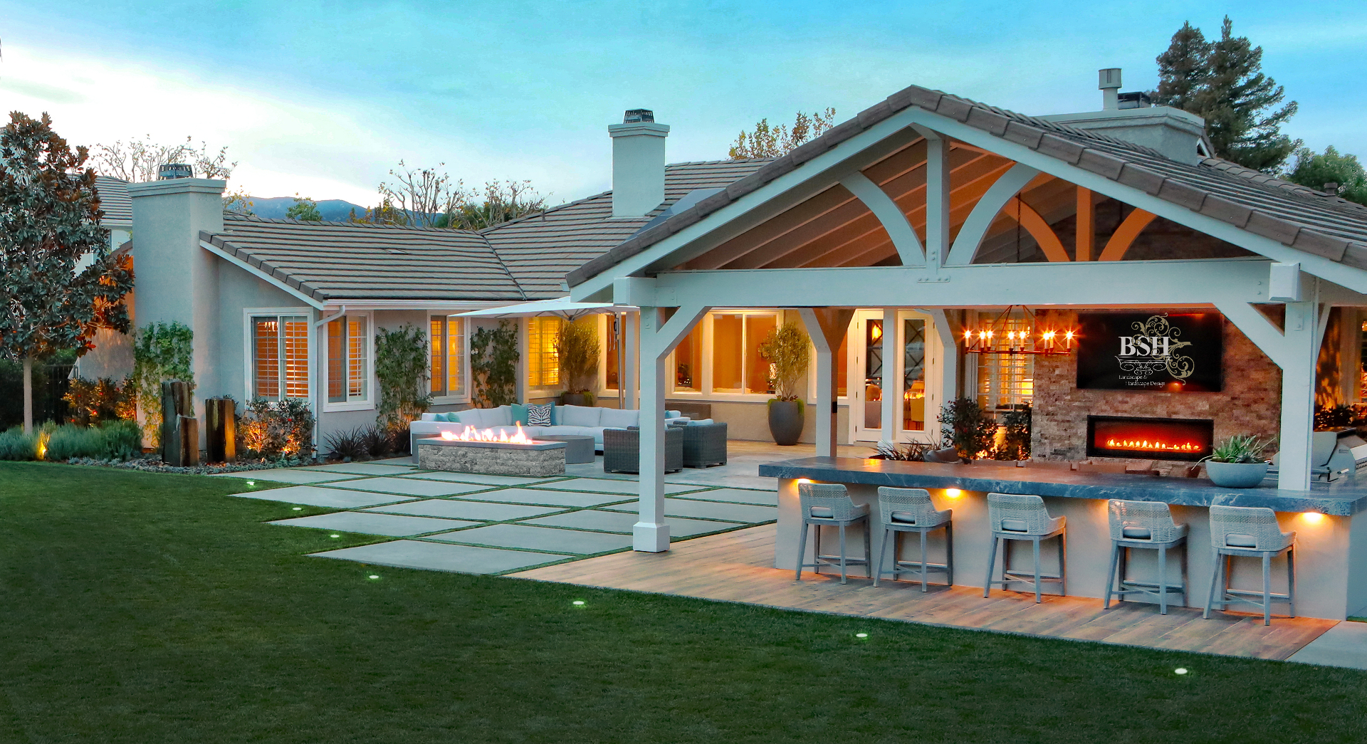BSH Outdoor Living Spaces — resort-style backyard with covered pavilion and fire pit